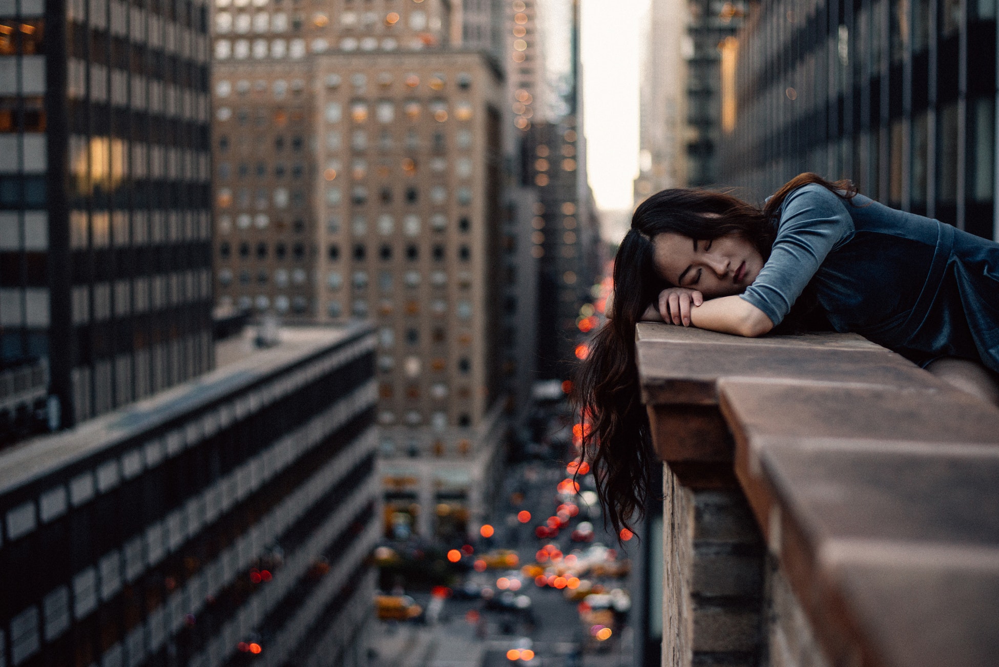 Woman asleep on balcony of high rise building in New York  Stills by Hernan.com.jpg